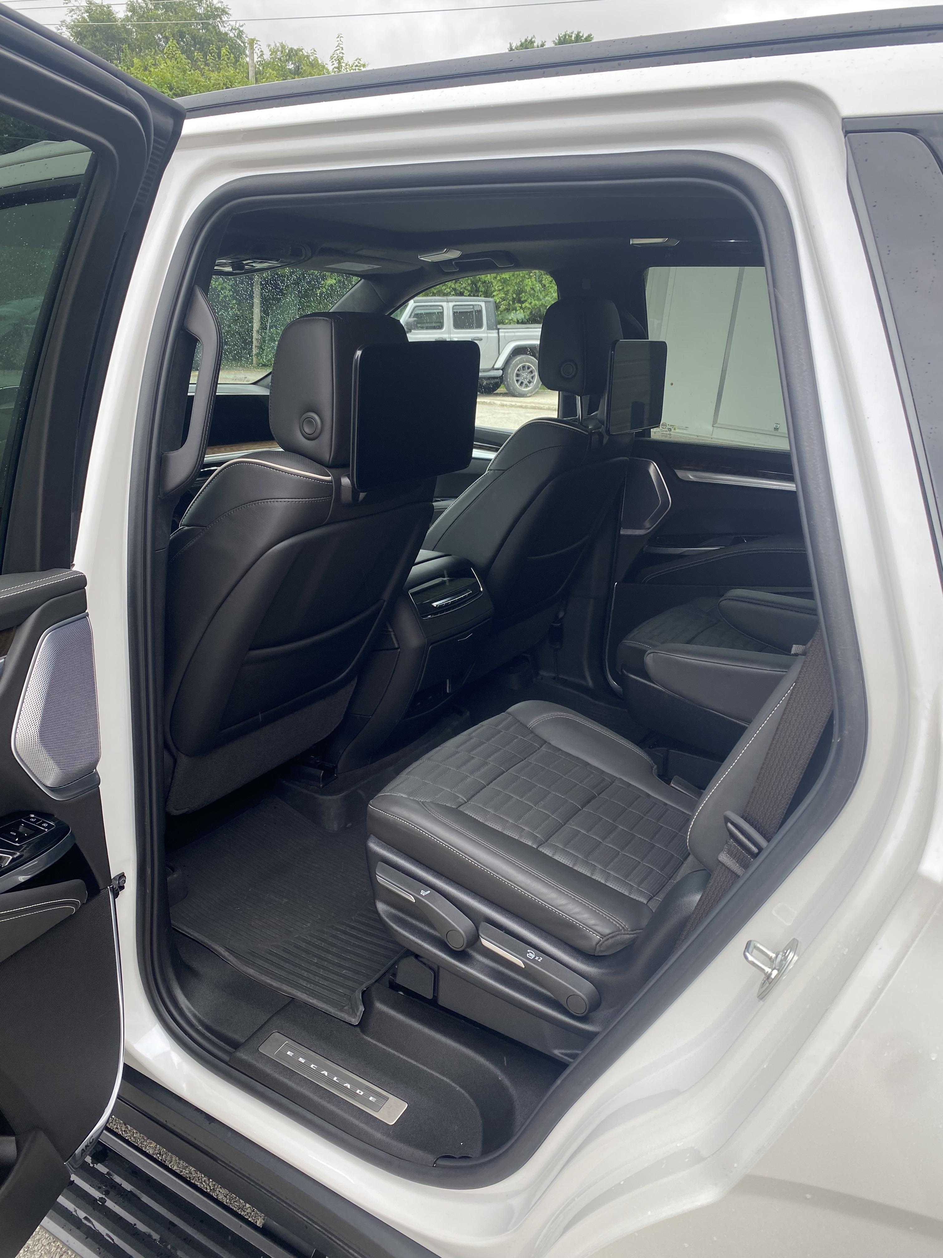 Cadillac Escalade rear seats with entertainment screens, freshly detailed
