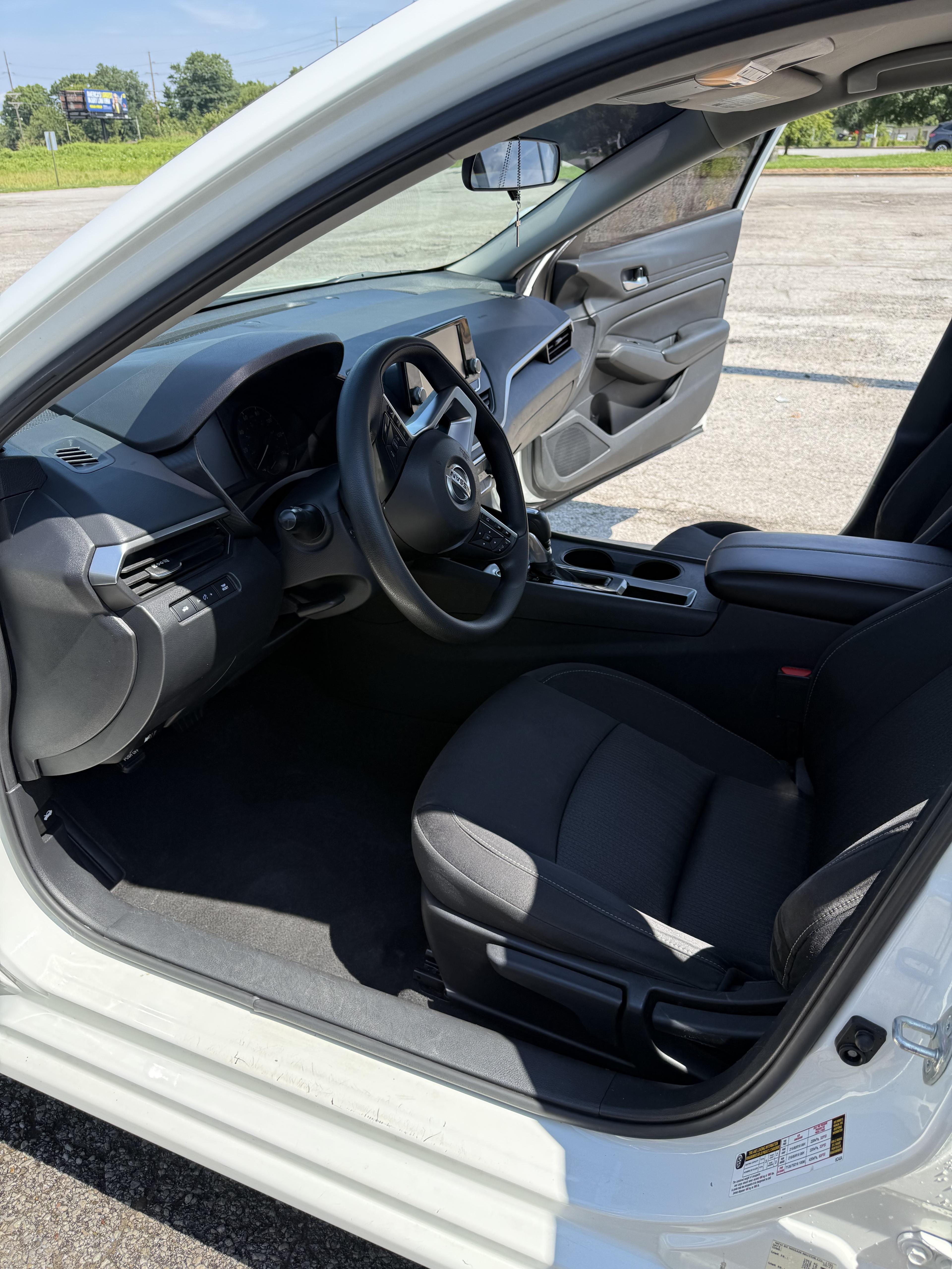 Nissan Altima front seat and dashboard, freshly detailed