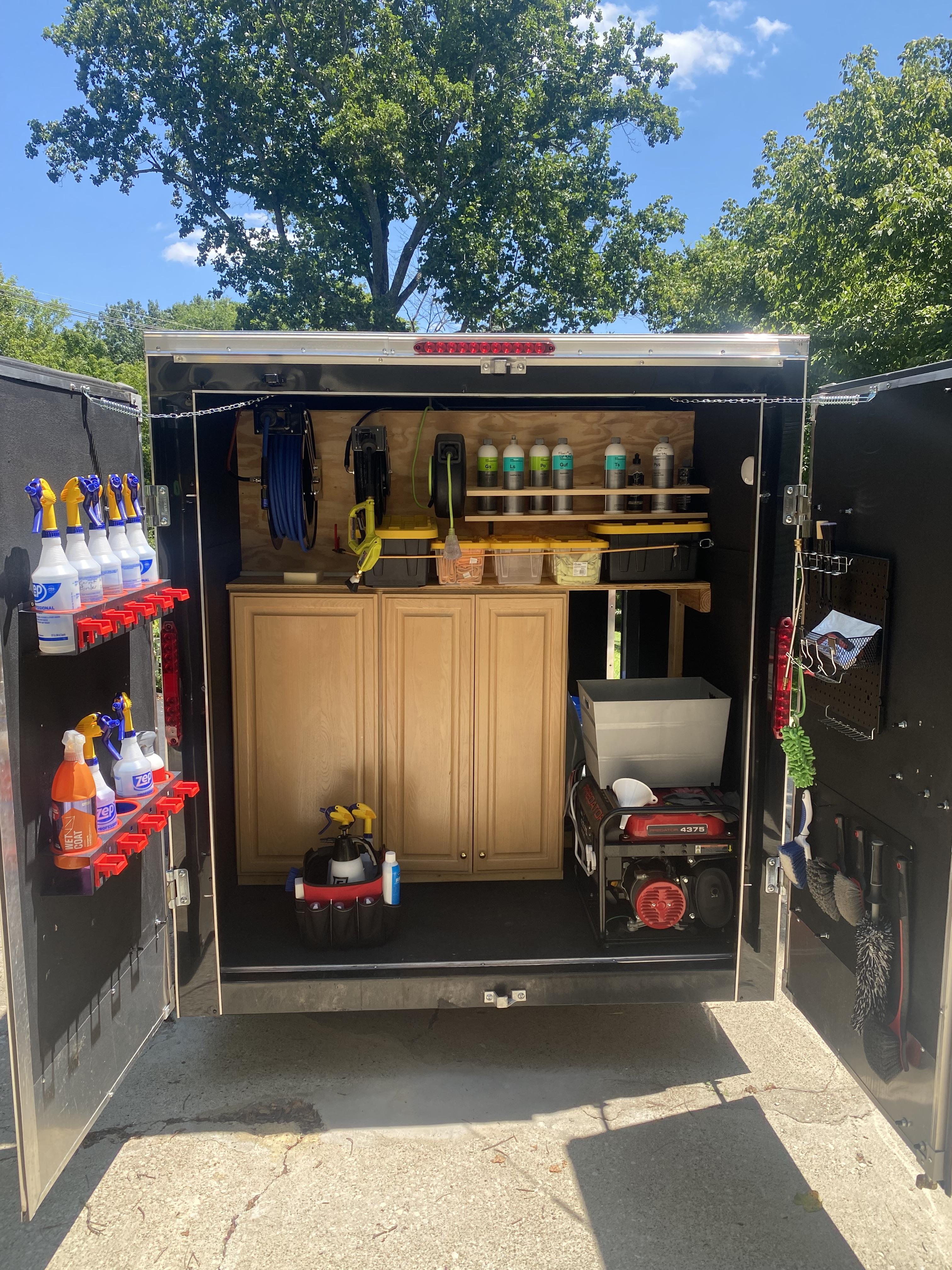Organized professional detailing equipment inside the Kurtz Details trailer